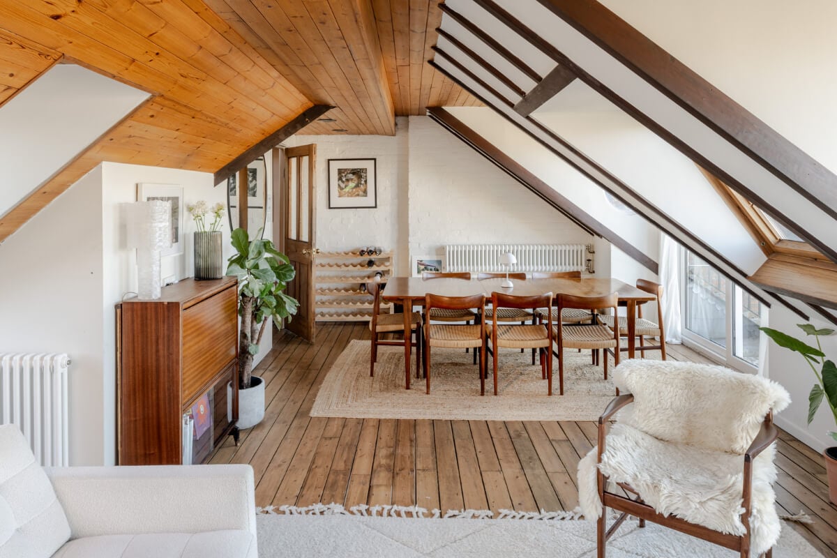 A Light Duplex Apartment in an Arts and Crafts Building 5 large dining table attic living space