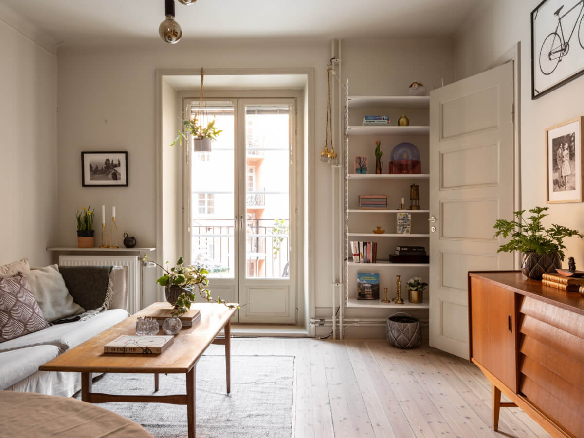 A Charming One-Bedroom Apartment in Södermalm 2 light living room glass doors wooden floor