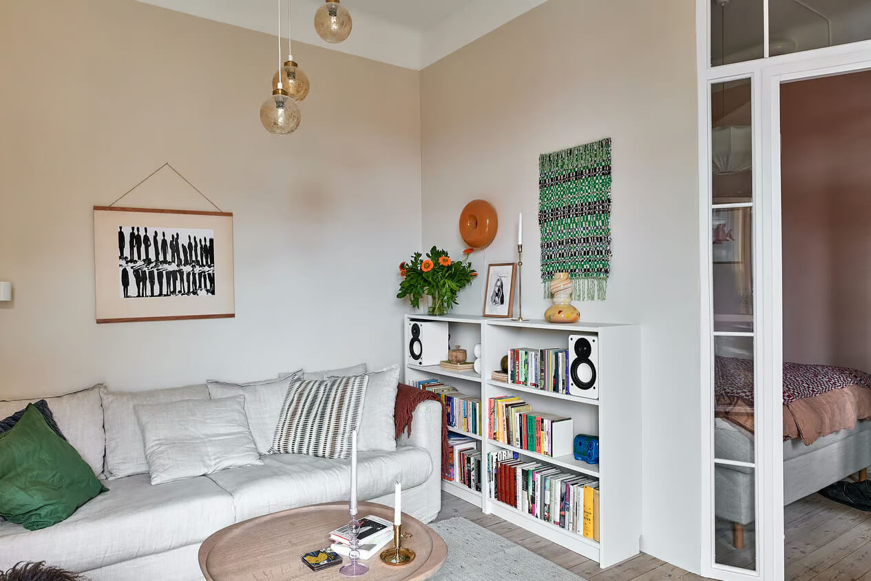 A Charming Swedish Apartment with a Spacious Balcony 3 living room bookcases