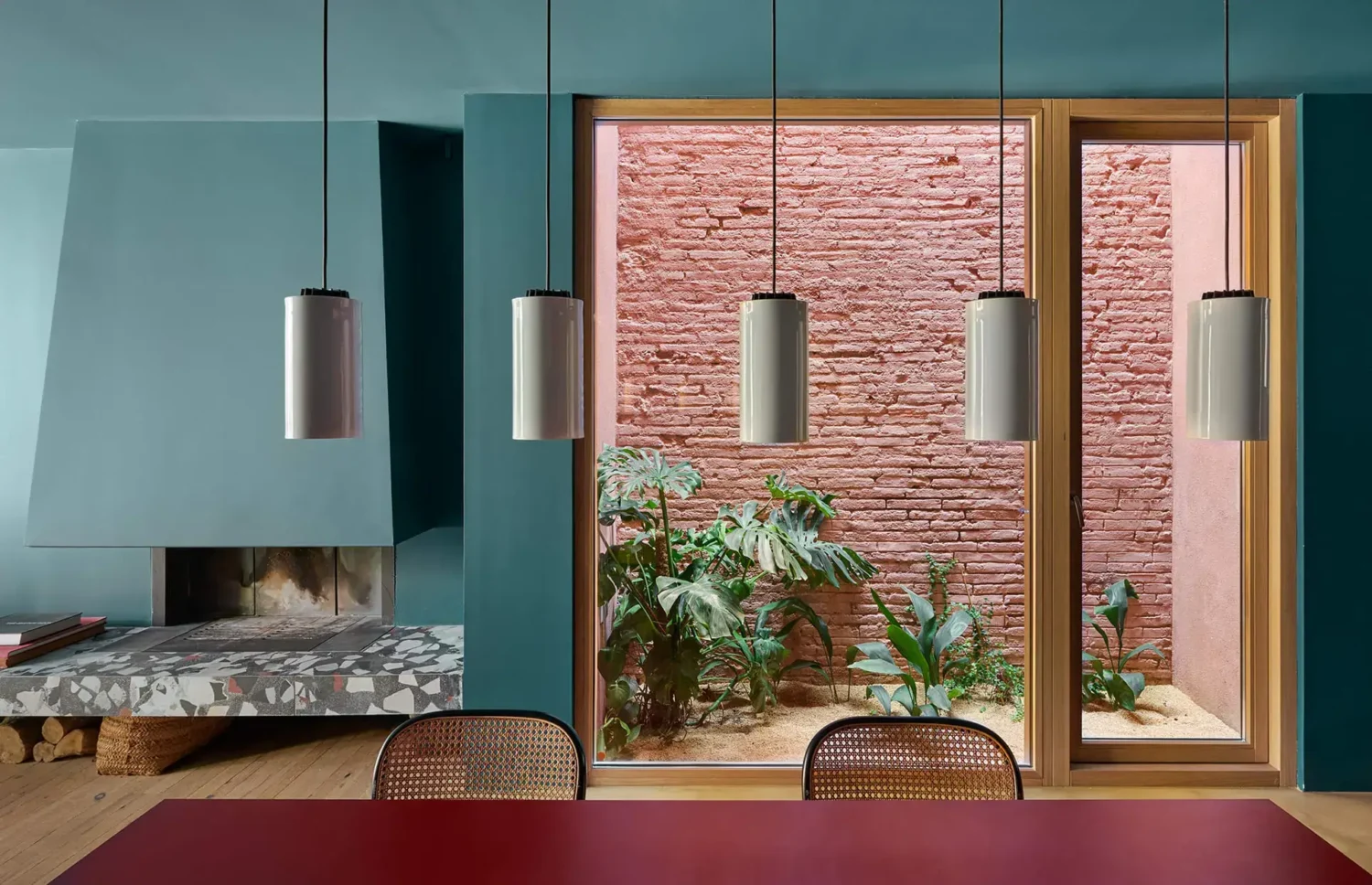 Colorful Contemporary Interiors in a 1930s Spanish House 3 living room fireplace patio