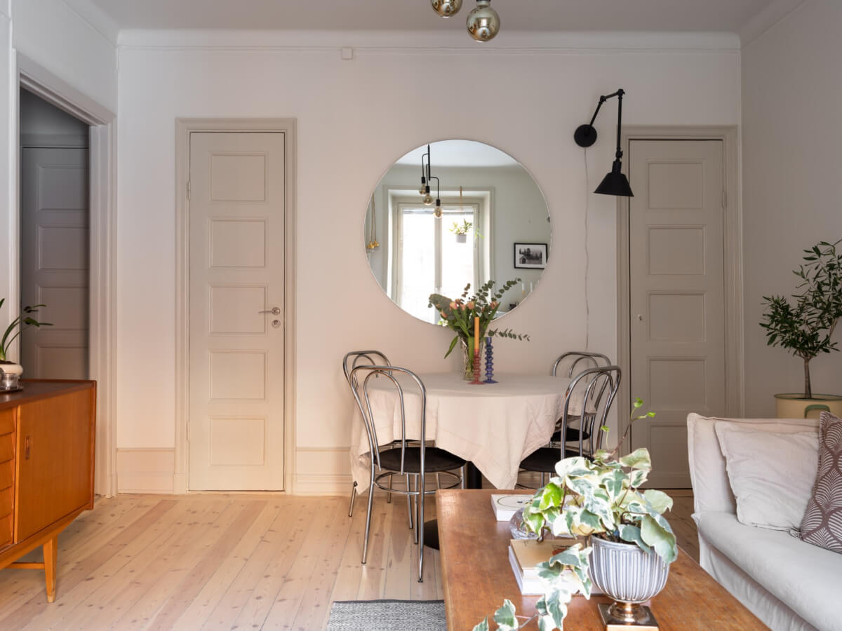 A Charming One-Bedroom Apartment in Södermalm 5 living room large round mirror