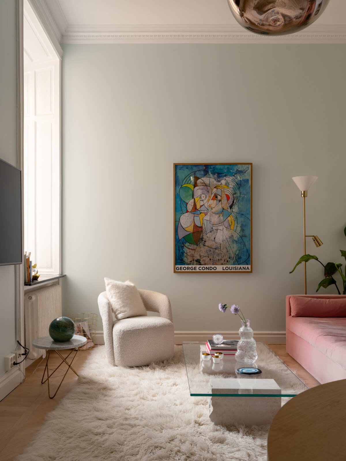 living room light blue-gray walls high ceiling pink sofa