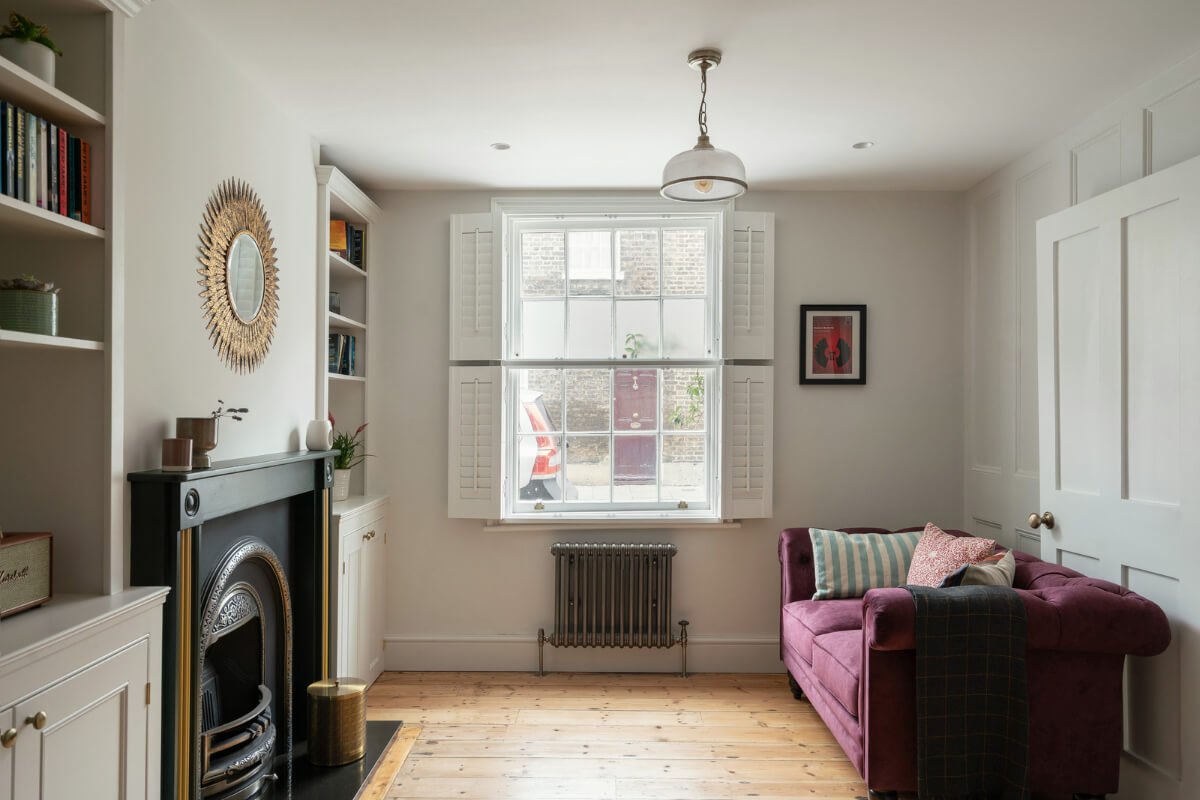 living room sash window fireplace wooden floor