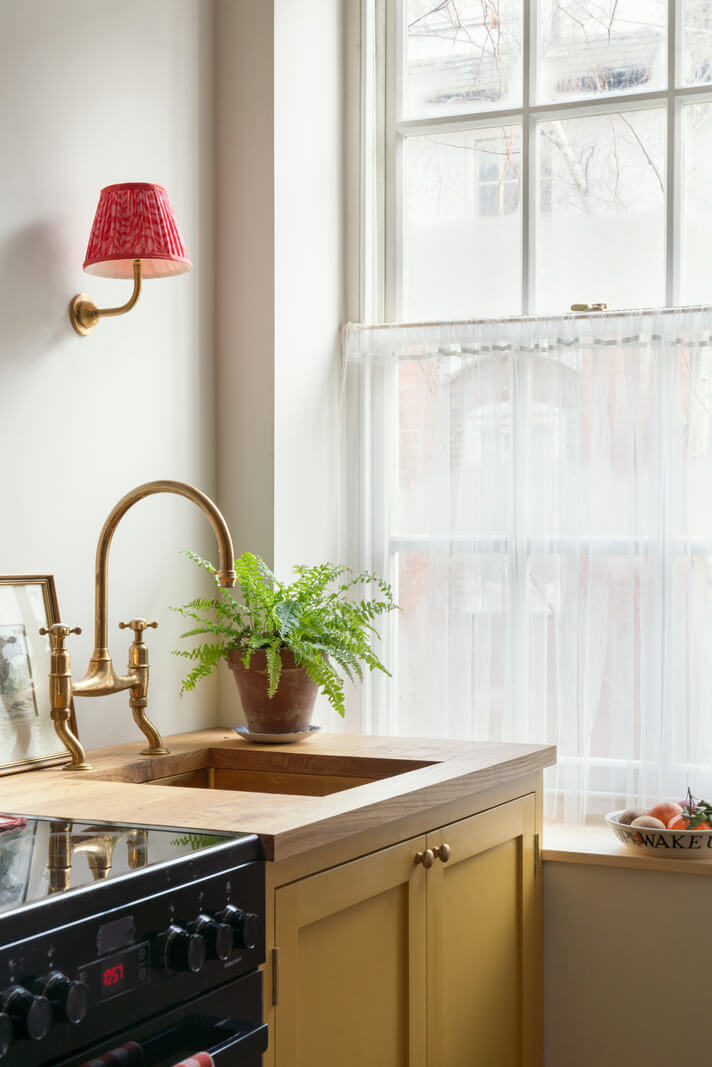 ochre yellow kitchen cabinets brass fittings