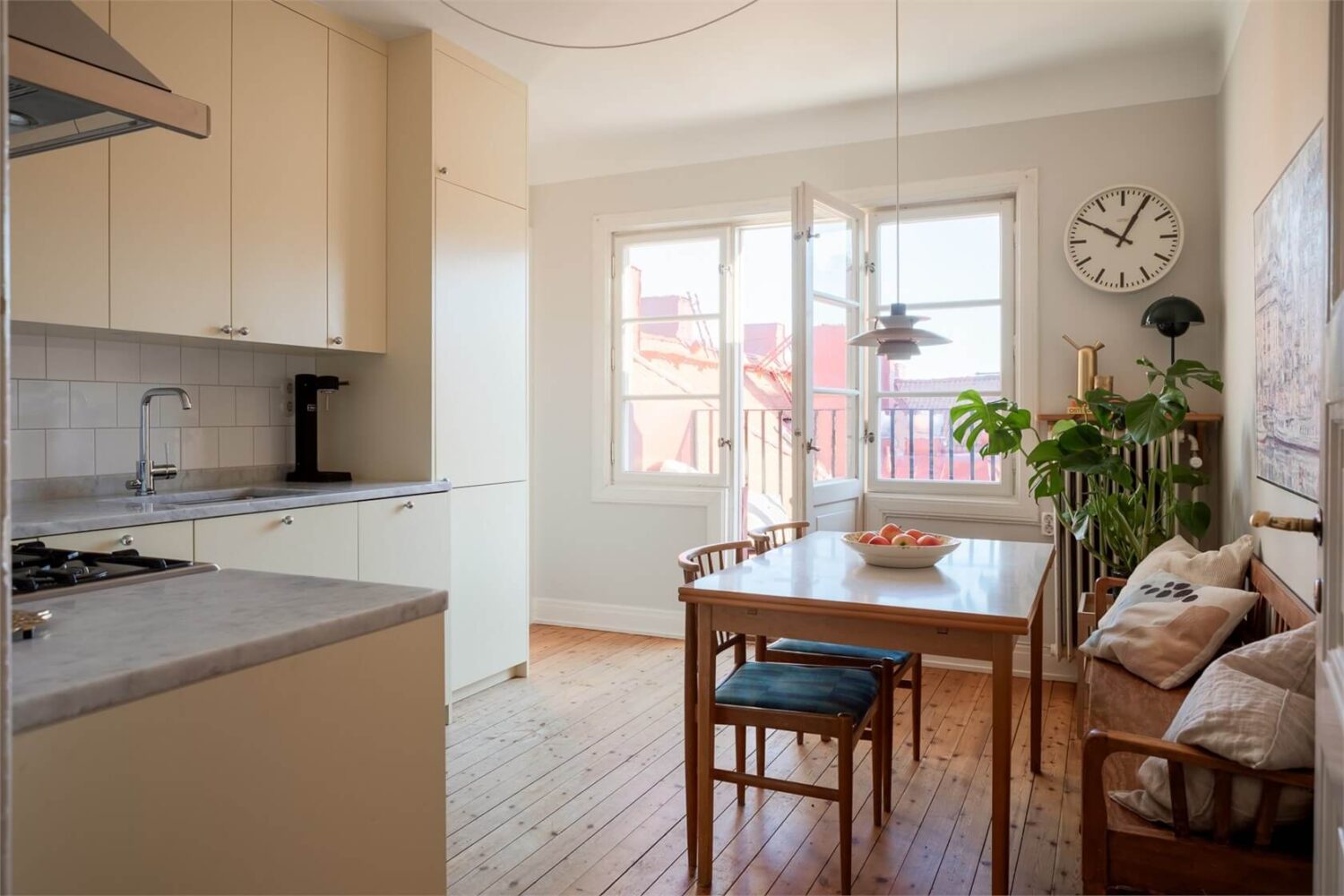 A Stockholm Apartment with a Light Yellow Kitchen 4 pale yellow kitchen with dining area