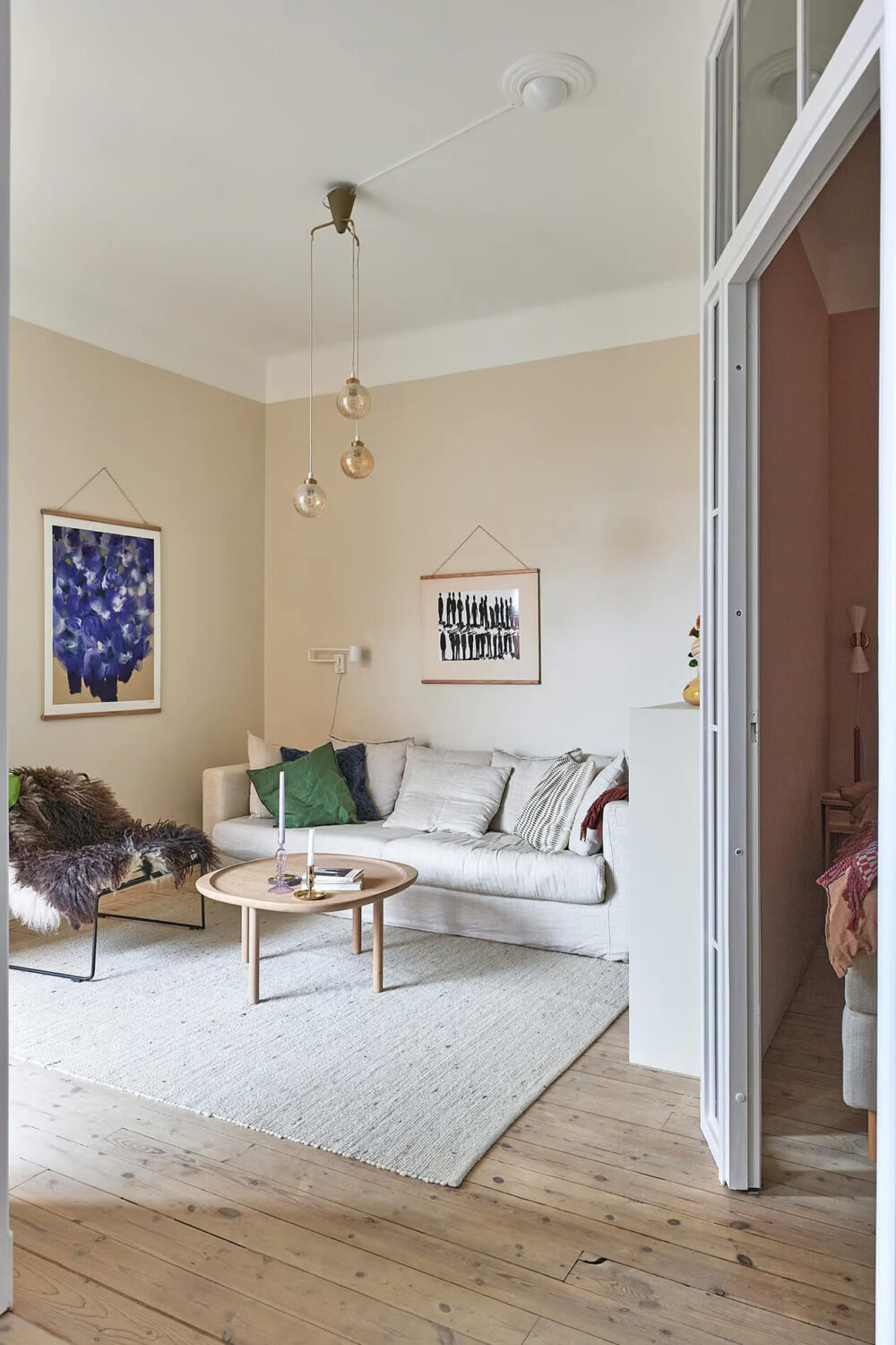 A Charming Swedish Apartment with a Spacious Balcony 1 scandi living room wooden floor