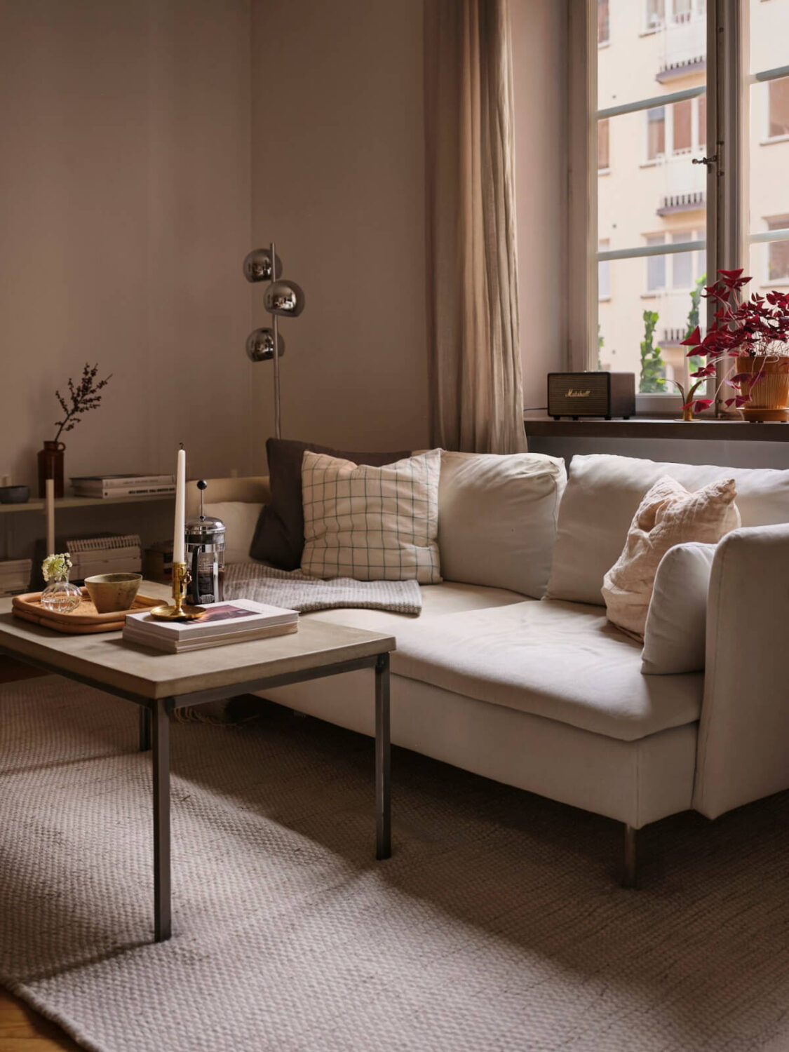 A Small Apartment with an Industrial Stainless Steel Kitchen 3 small living room white sofa