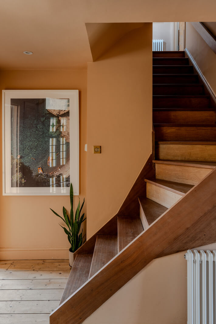 A Light Duplex Apartment in an Arts and Crafts Building 20 terracotta wall staircase