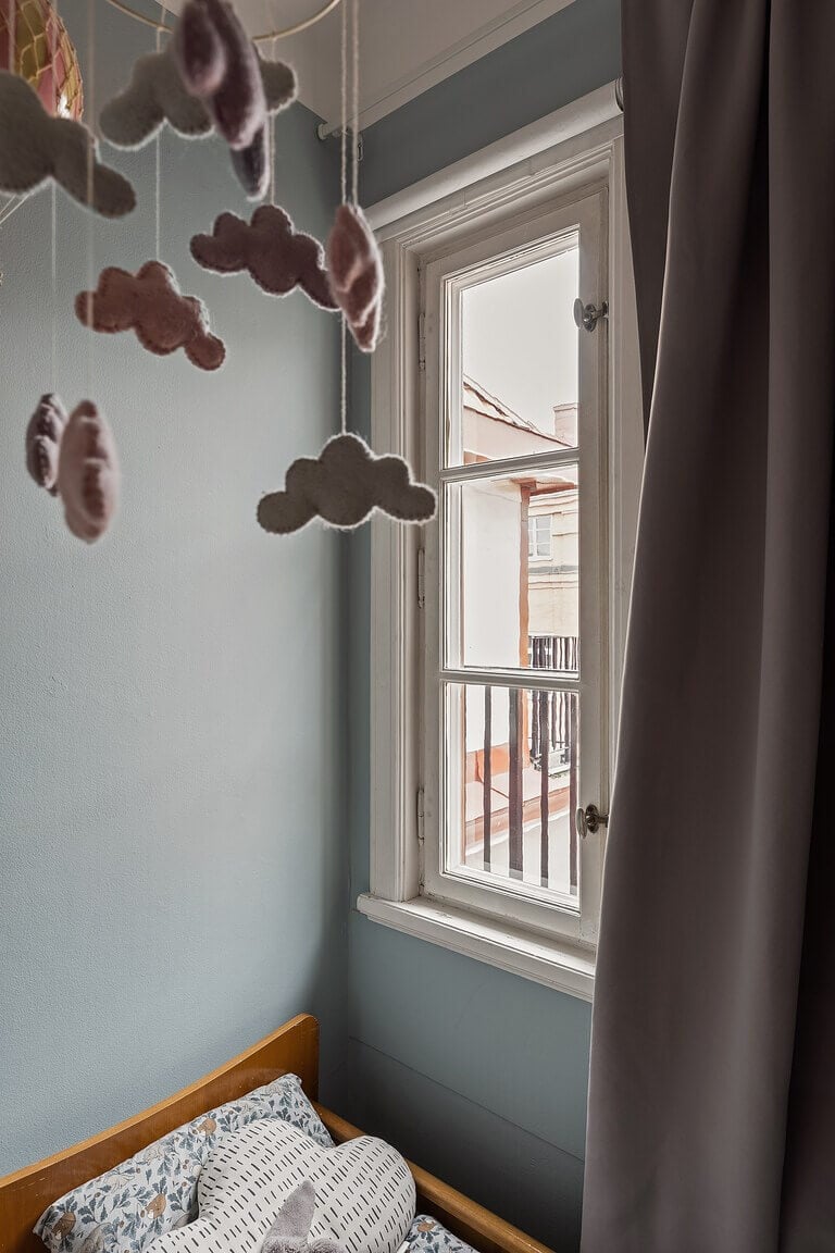 A Stockholm Apartment with a Light Yellow Kitchen 22 tiny blue nursery