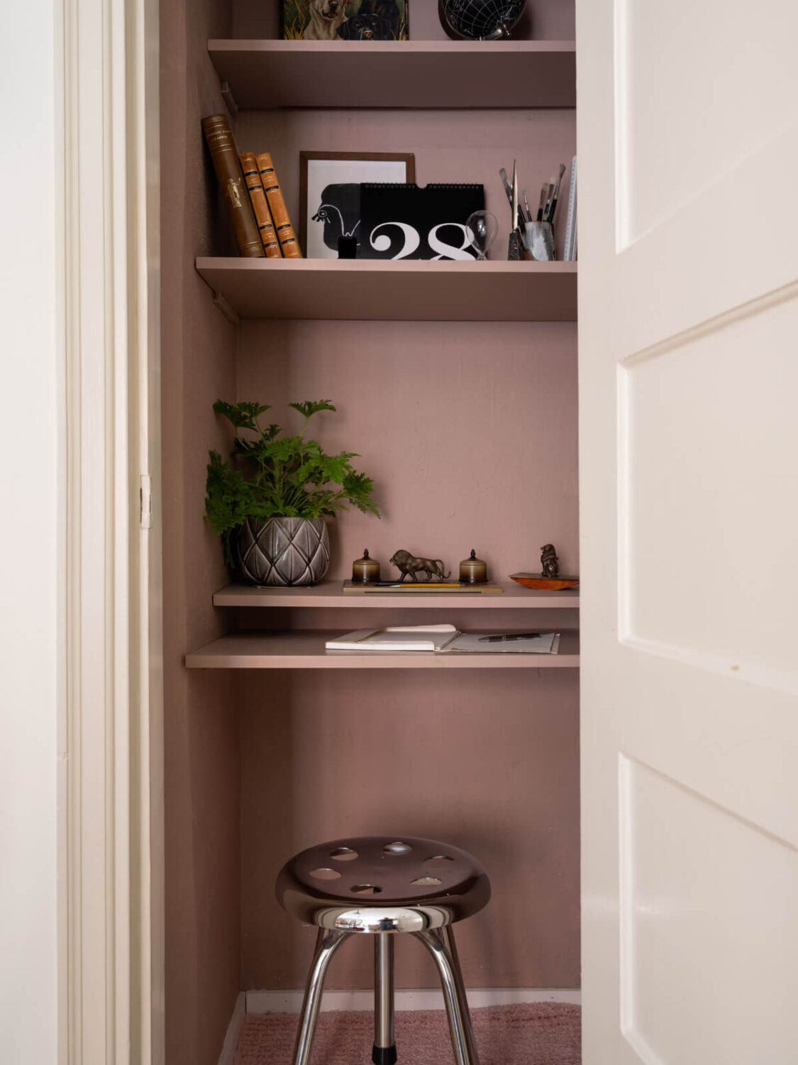 A Charming One-Bedroom Apartment in Södermalm 6 tiny pink home office in built-in closet nordroom