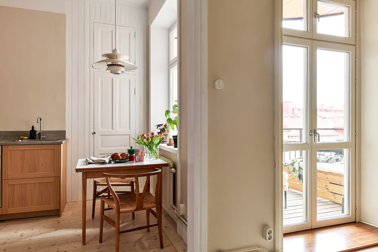 A Charming Swedish Apartment with a Spacious Balcony 9 view into kitchen
