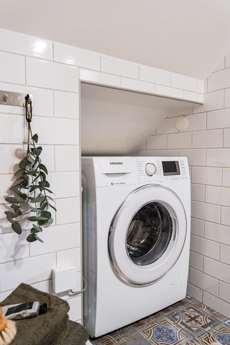 A Charming Duplex Apartment with a Stunning Kitchen 17 washing machine nook A Charming Duplex Apartment with a Stunning Kitchen