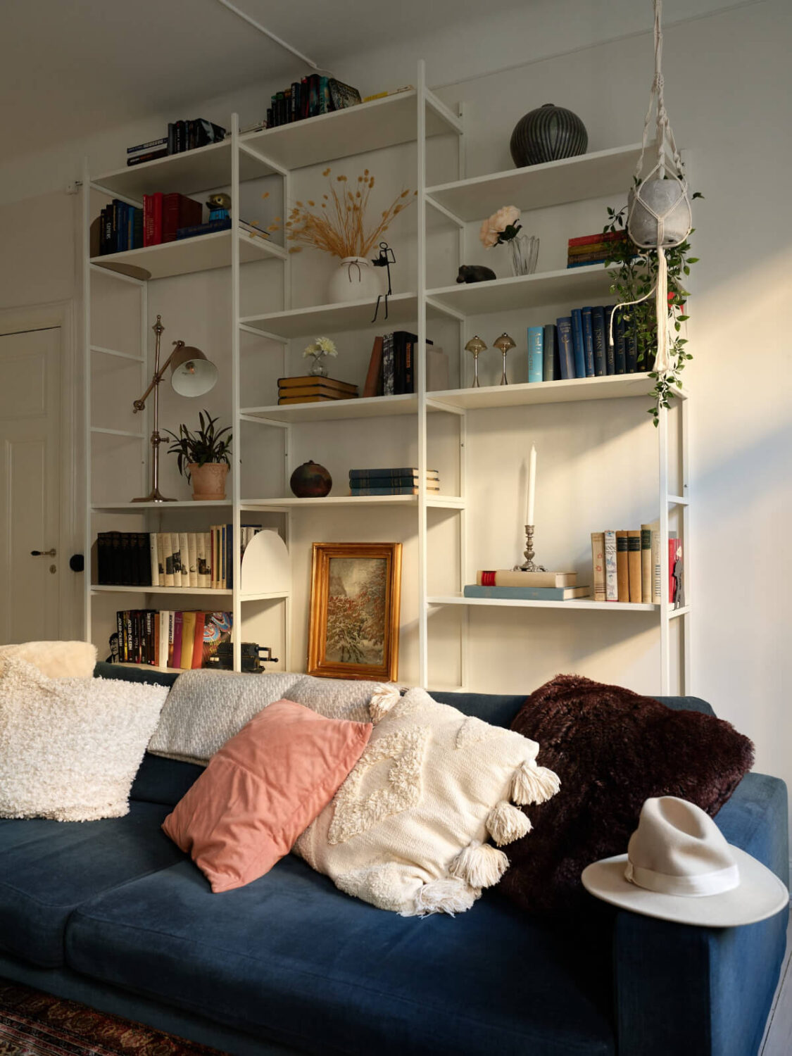 A Two-Bedroom Apartment with a Charming Bathroom 4 white bookshelves