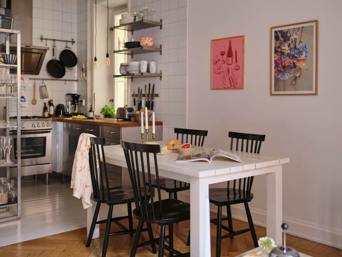 A Small Apartment with an Industrial Stainless Steel Kitchen 9 white dining table