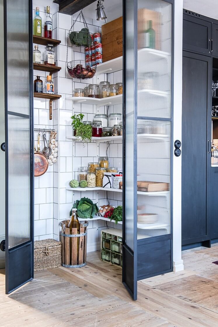 A Charming Duplex Apartment with a Stunning Kitchen 6 white tiles pantry steel ribbed glass doors