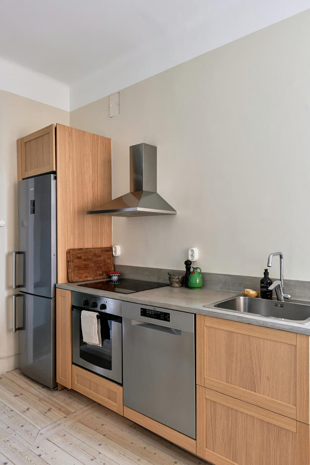 A Charming Swedish Apartment with a Spacious Balcony 18 wooden kitchen gray worktop