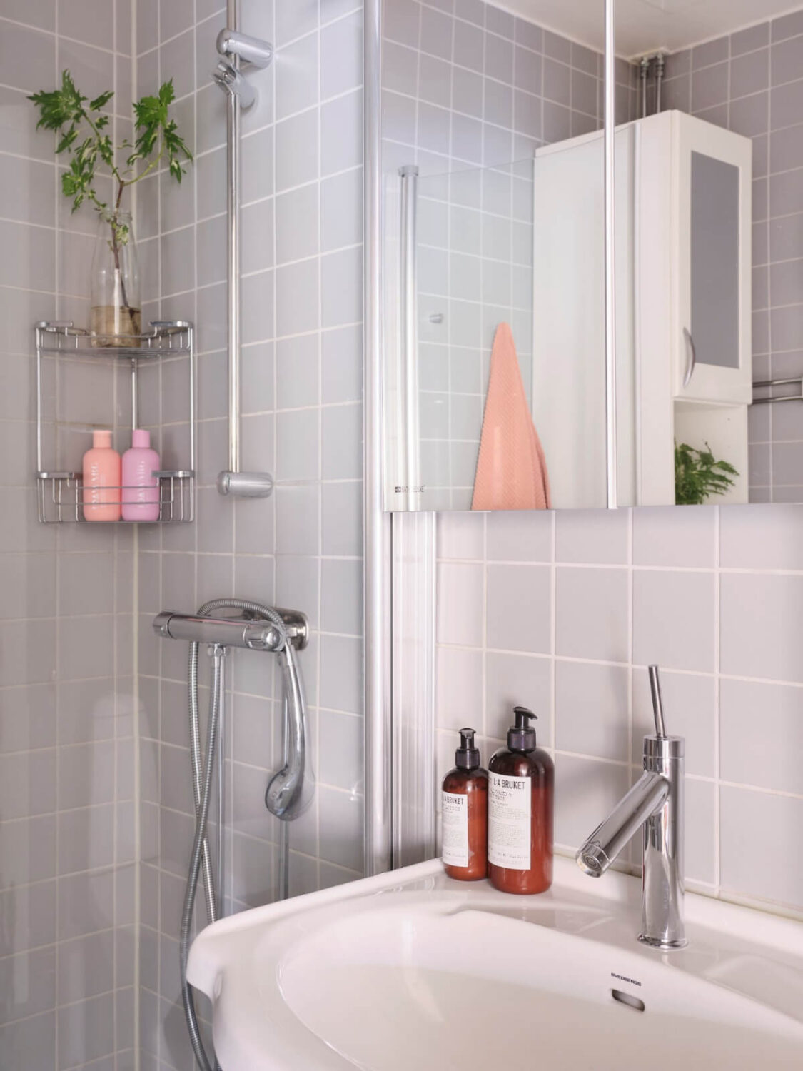 A Corner Apartment with Period Features and Bright Color Pops 24 bathroom blue-gray tiles