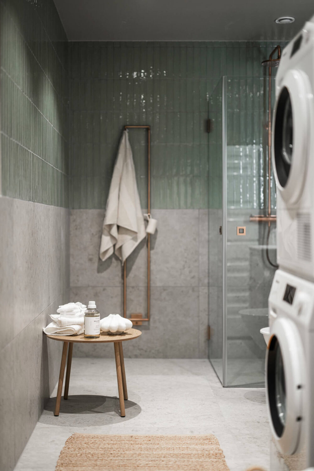 A Light-Filled Contemporary Swedish Apartment 24 bathroom blue-green tiles