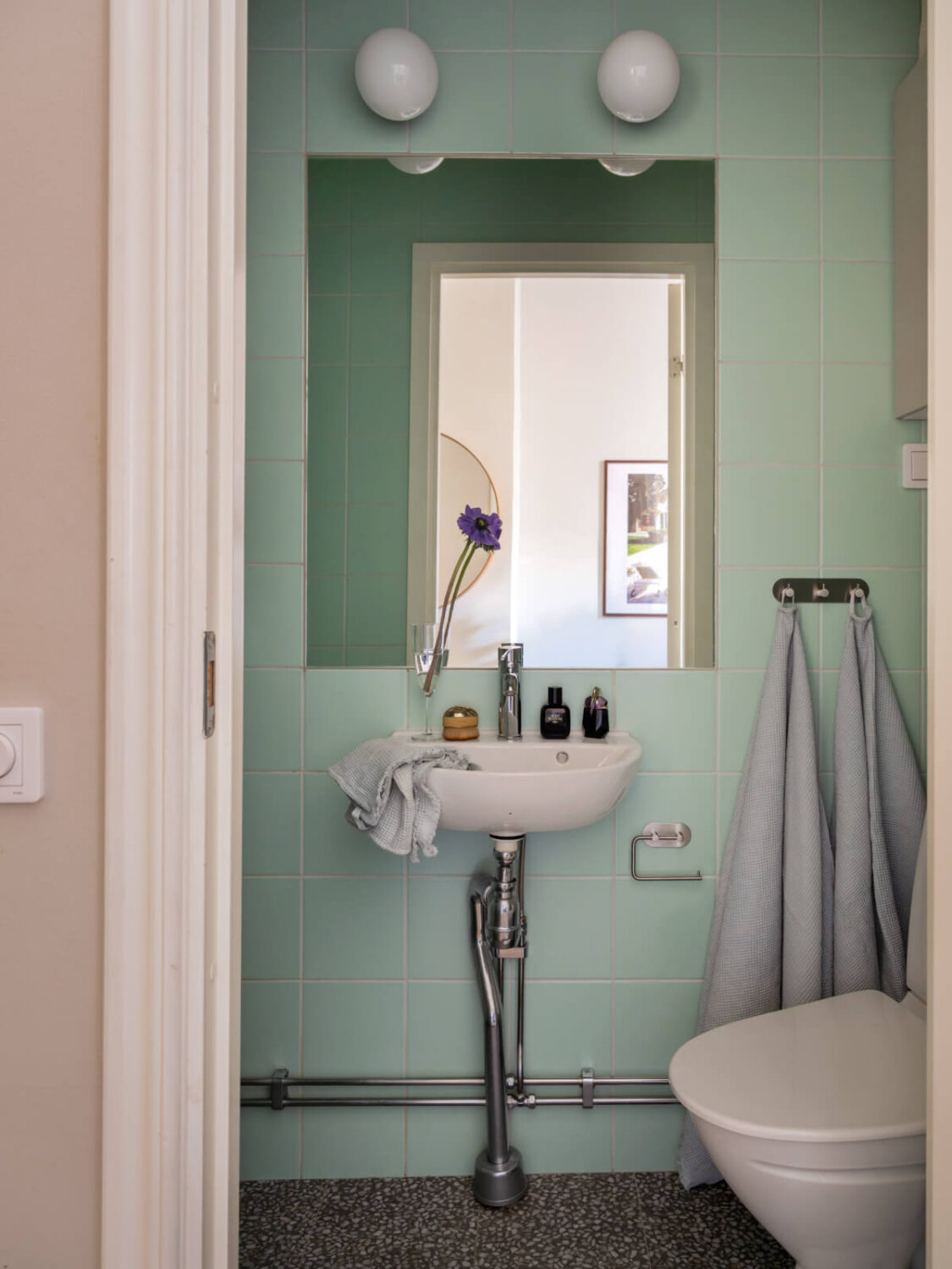 A Small Apartment with Contemporary Furniture in a 19th-Century Building 22 bathroom mint green tiles