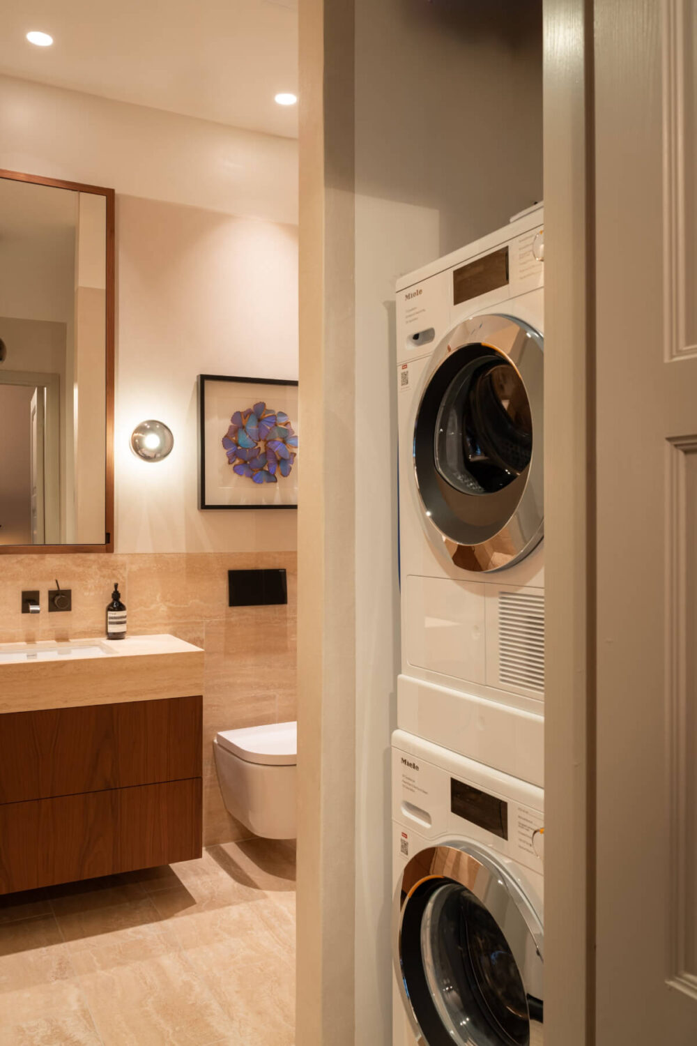 Hotel-Style Interiors in a Late 19th Century Apartment in Stockholm 20 bathroom washer dryer cabinet