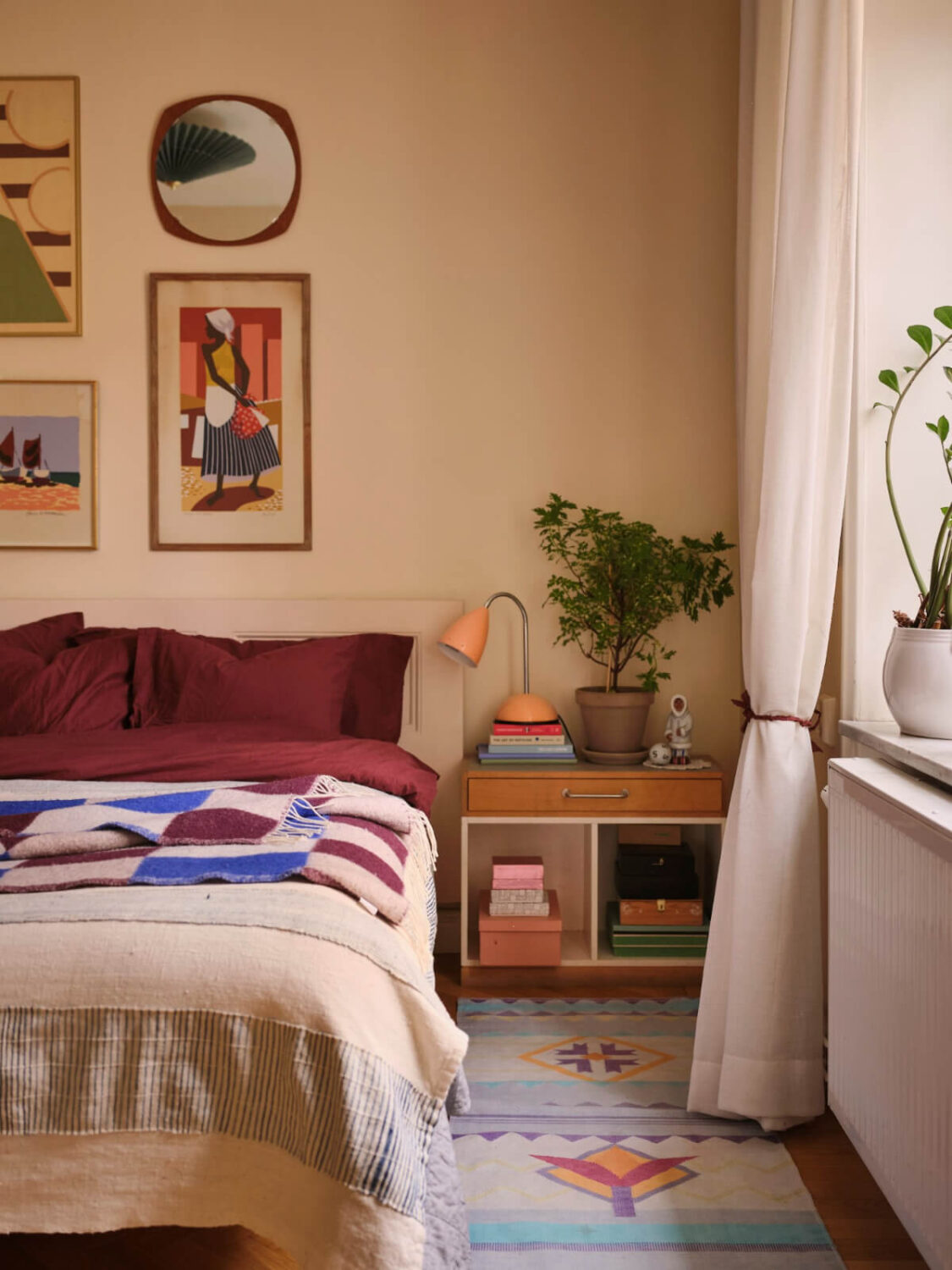 A Corner Apartment with Period Features and Bright Color Pops 12 bedroom beige-yellow walls colorful art and textiles