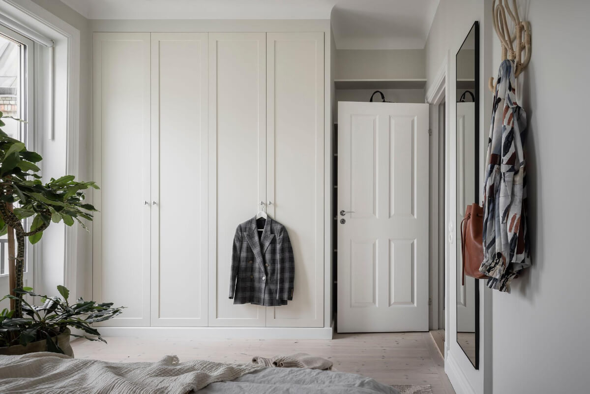 A Light Color Palette in a Stylish Renovated Late 19th Century Apartment 20 bedroom built-in wardrobes