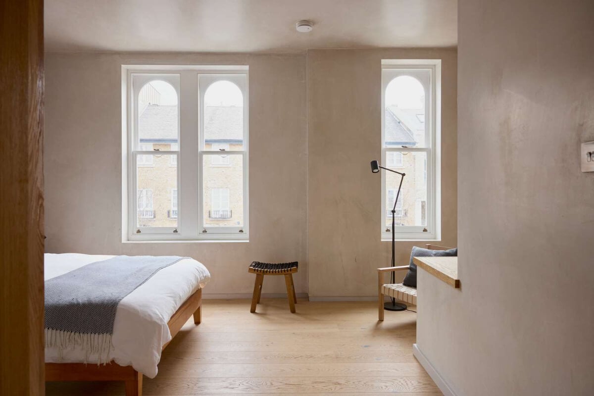 Contemporary Architect-Designed Interiors in a Victorian House 14 bedroom gray plaster walls wooden floor