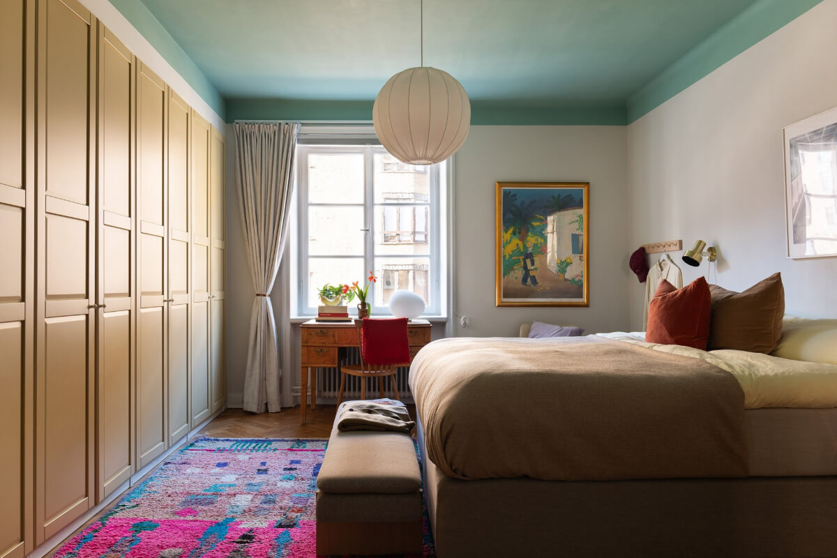 bedroom green ceiling ochre built-in wardrobes