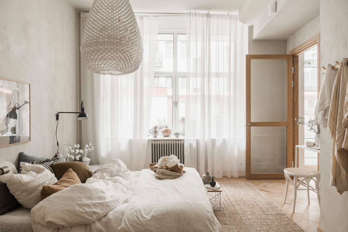 A Light-Filled Contemporary Swedish Apartment 20 bedroom high ceilings sheer white curtains