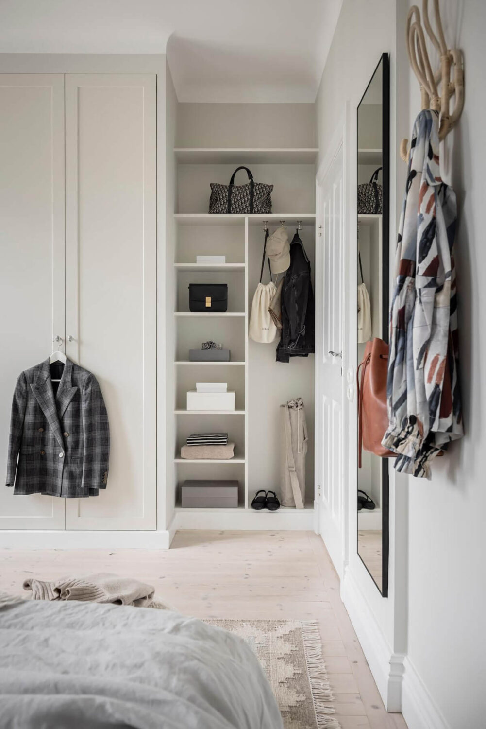 A Light Color Palette in a Stylish Renovated Late 19th Century Apartment 21 bedroom shelves