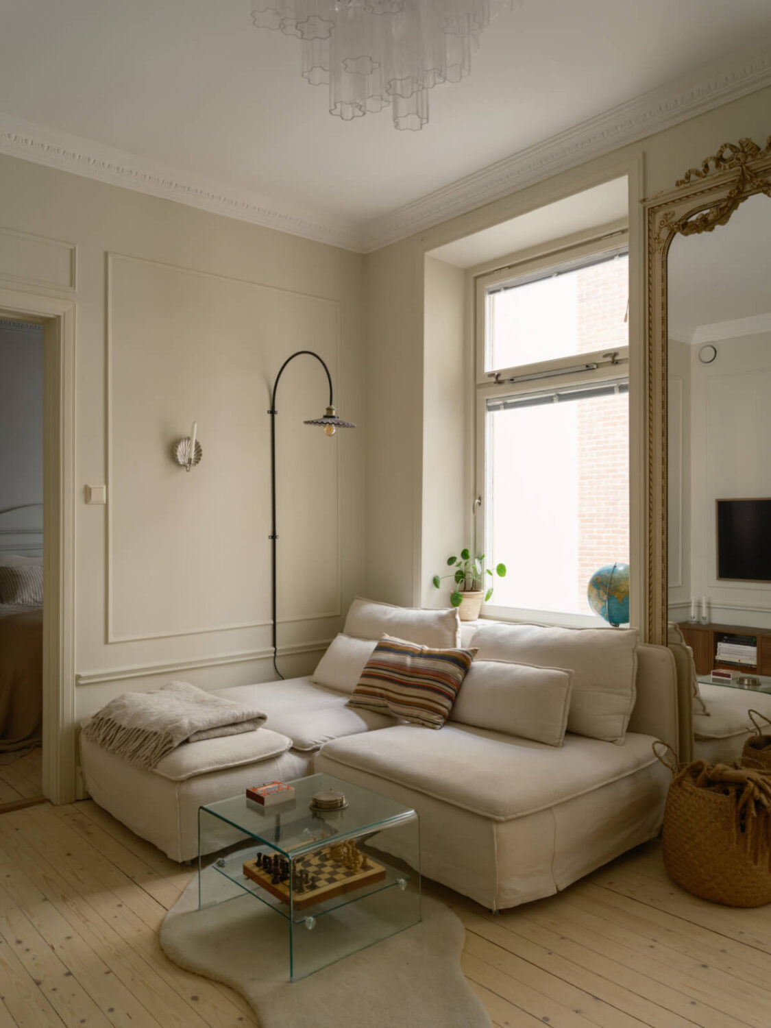 A Serene 19th Century Apartment with a Deep Red Kitchen 2 beige living room large mirror