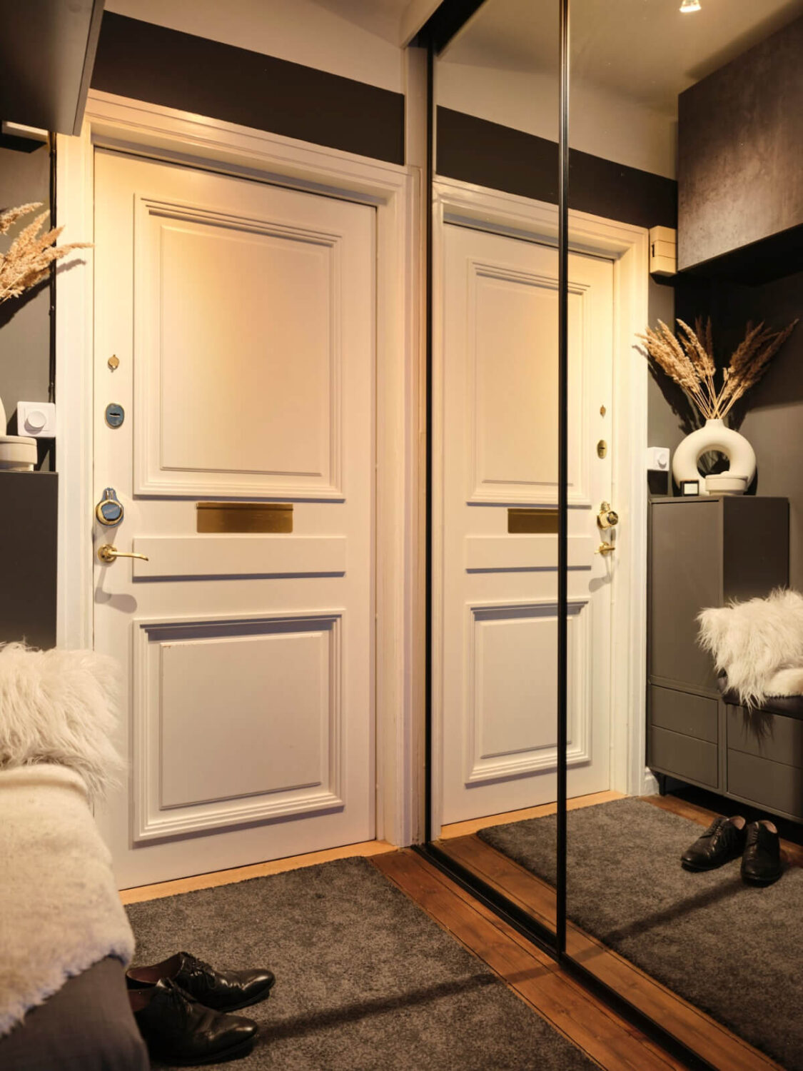 A Light-Filled 1920s Apartment with Two Spacious Balconies 31 black hall with mirror door wardrobes A Light-Filled 1920s Apartment with Two Spacious Balconies