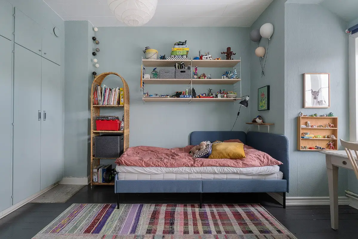 A Charming Early 20th-Century Family Home in Sweden 14 blue kids bedroom built-in wardrobes