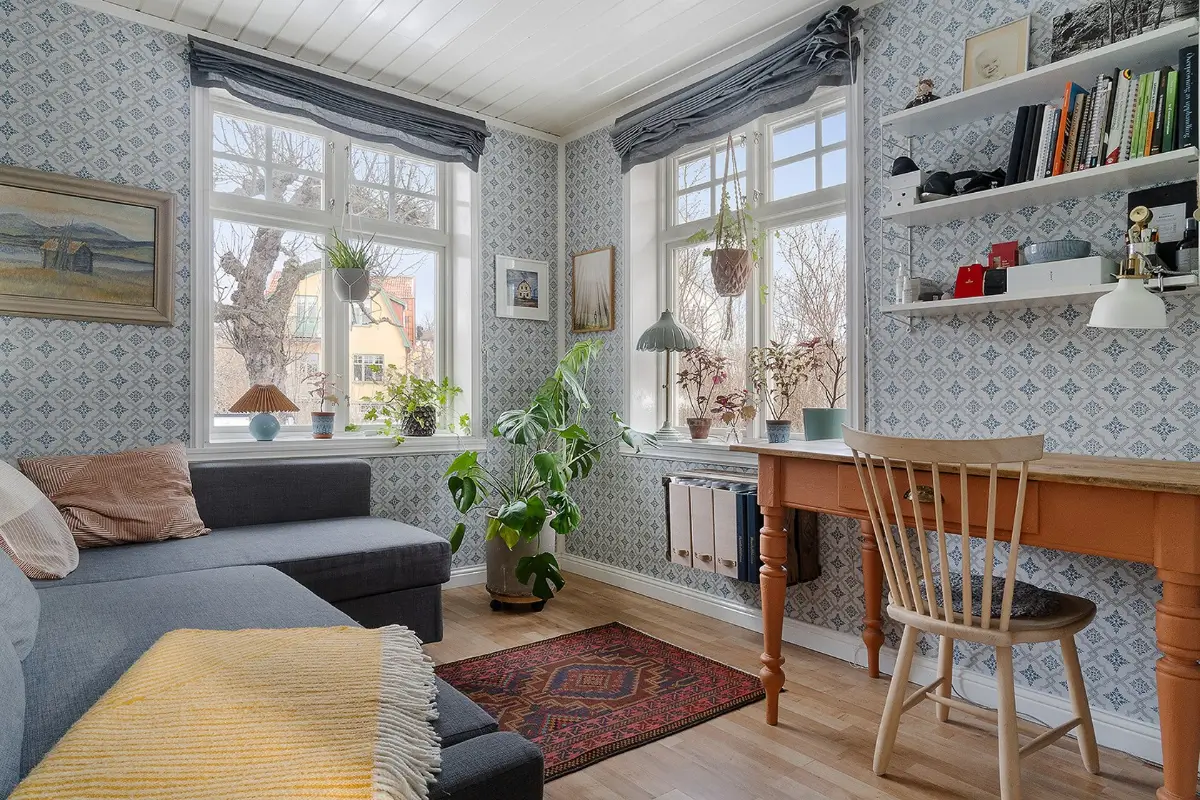 A Charming Early 20th-Century Family Home in Sweden 7 blue wallpaper living room desk