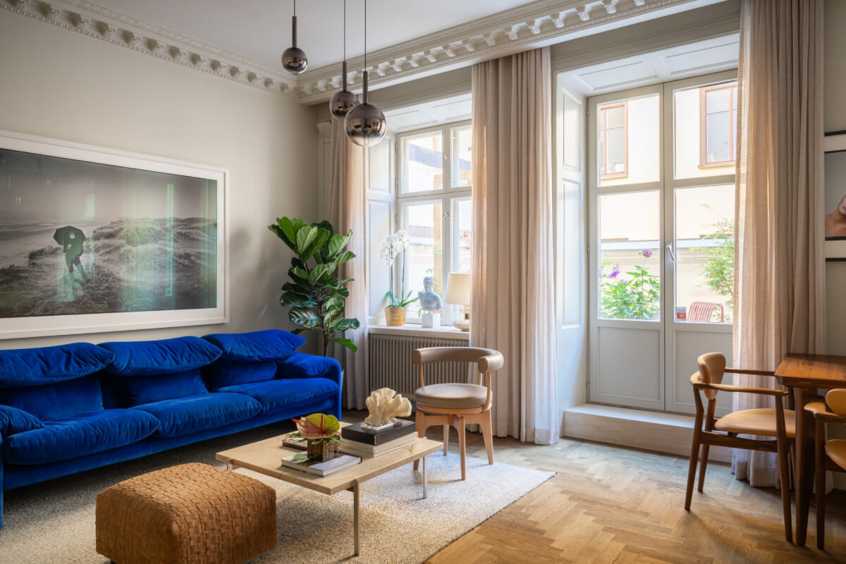 Hotel-Style Interiors in a Late 19th Century Apartment in Stockholm 2 classic gray living room blue sofa