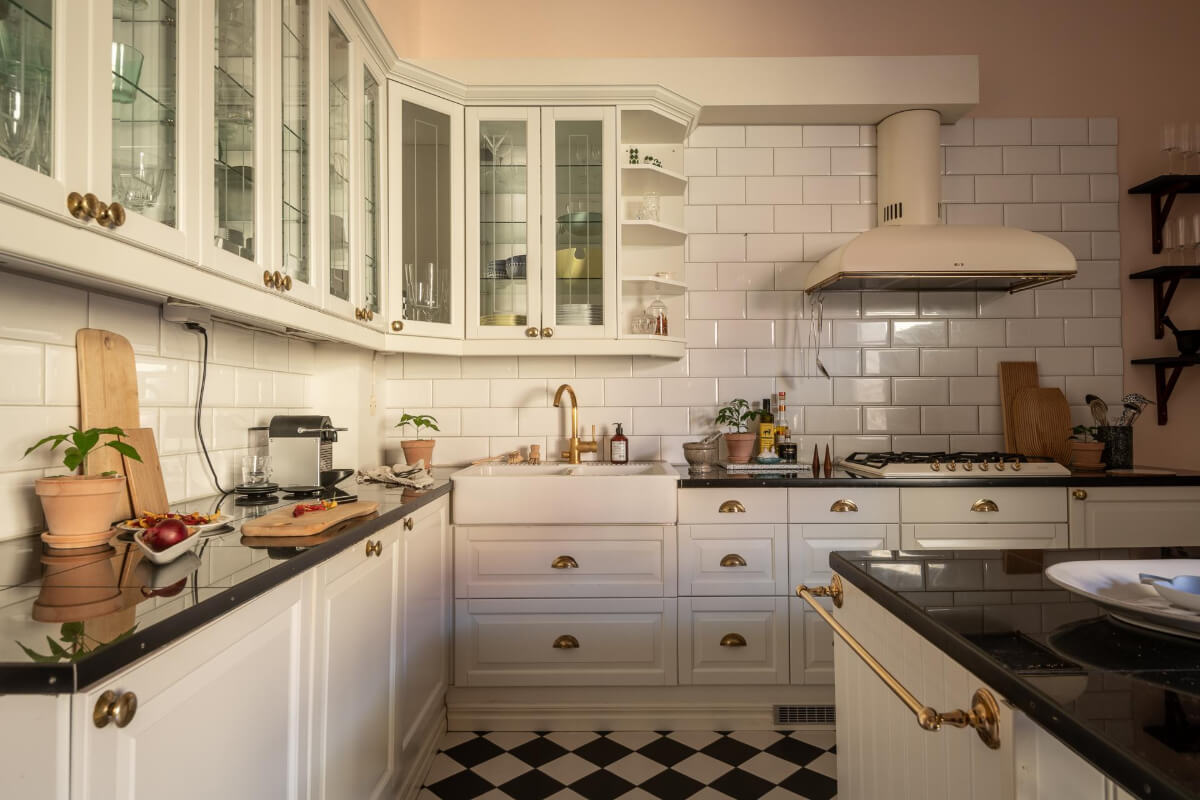 A Light and Spacious Apartment with a Cozy Social Kitchen 18 classic white kitchen brass fittings butler sink