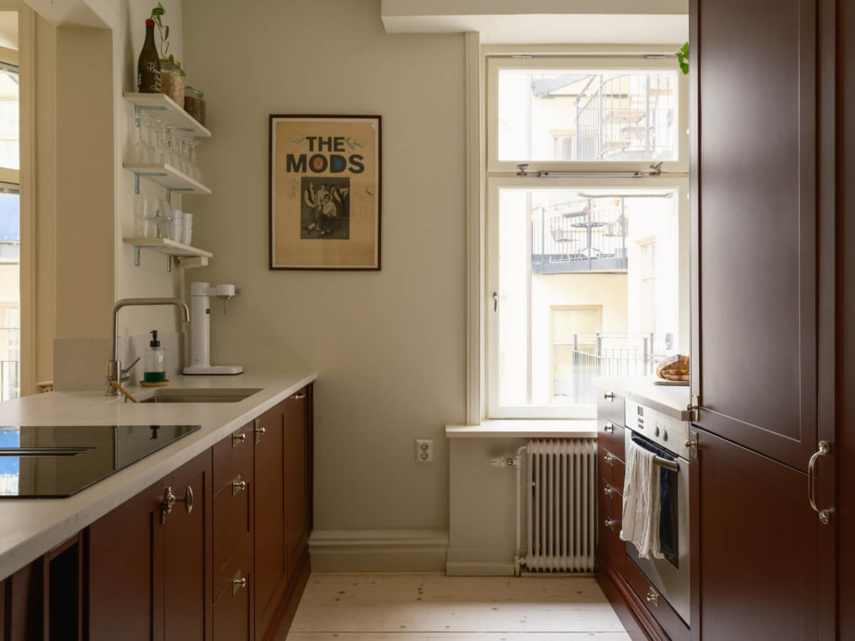 A Serene 19th Century Apartment with a Deep Red Kitchen 10 dark red galley kitchen