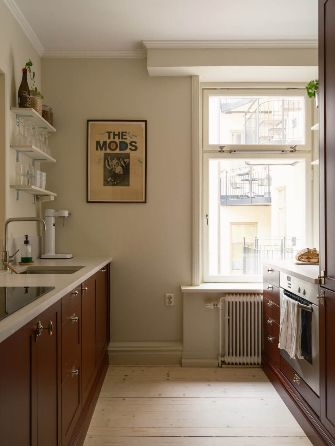 A Serene 19th Century Apartment with a Deep Red Kitchen 9 dark red kitchen cabinets shelves