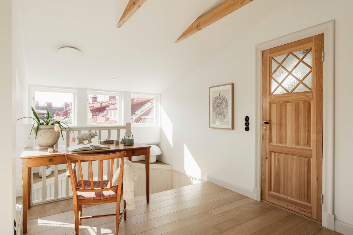 A Swedish Duplex Apartment Inspired by A Danish Summer House 7 desk attic room wooden beams