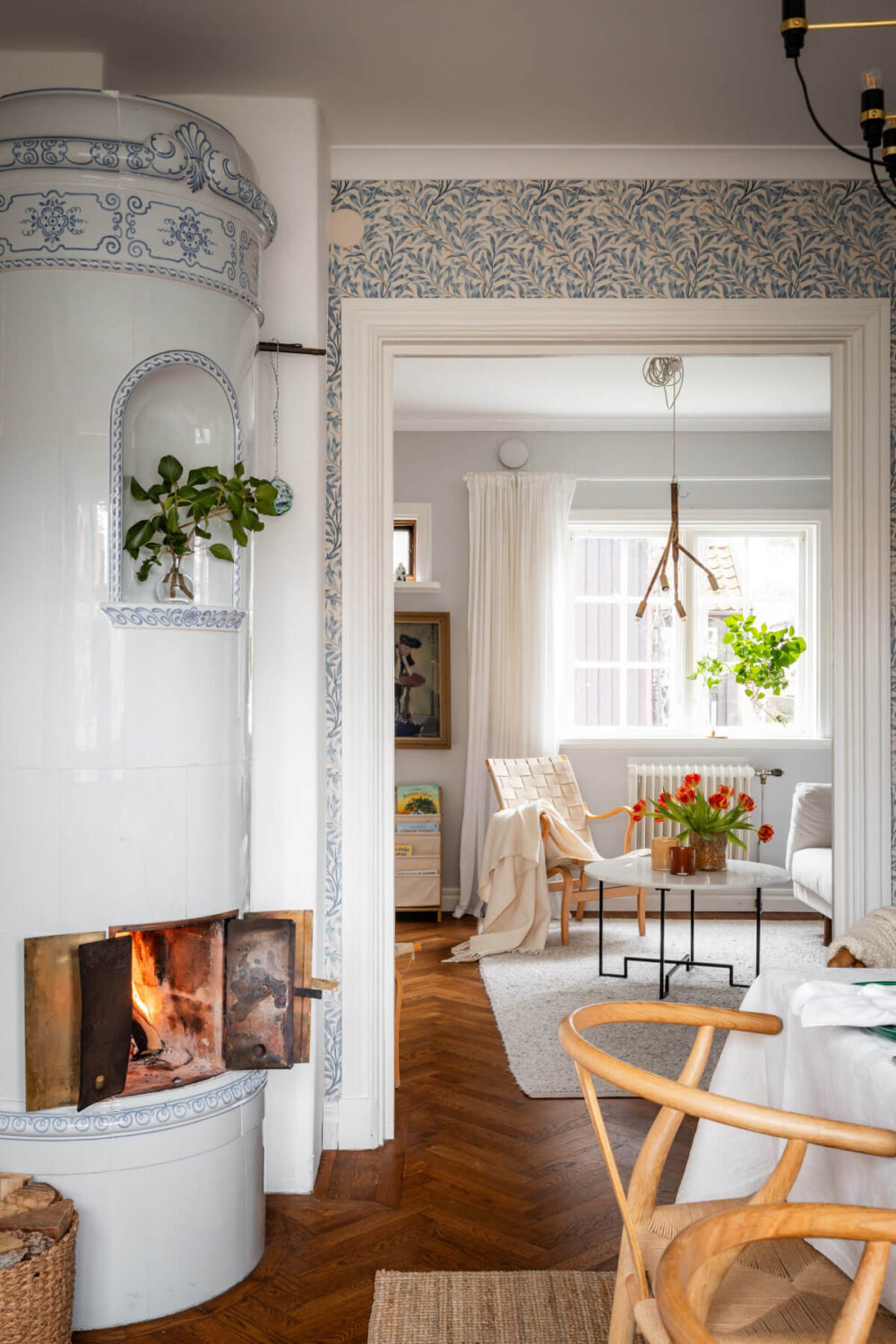 Turn-of-the-Century Charm Meets Modern Comfort in a Swedish House 9 fireplace blue decoration