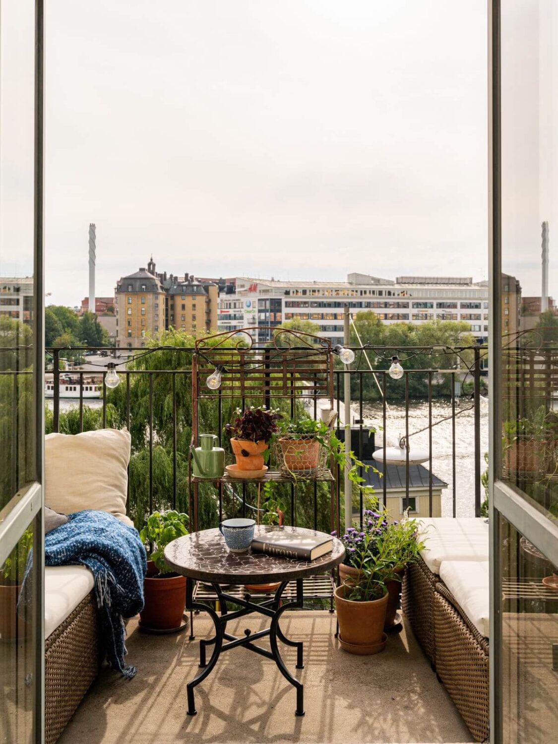 Gray Tones and Built-in Storage in a Charming Corner Apartment 4 glass doors balcony