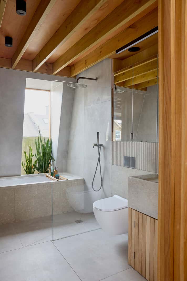 Contemporary Architect-Designed Interiors in a Victorian House 22 gray tiles wooden ceiling bathroom