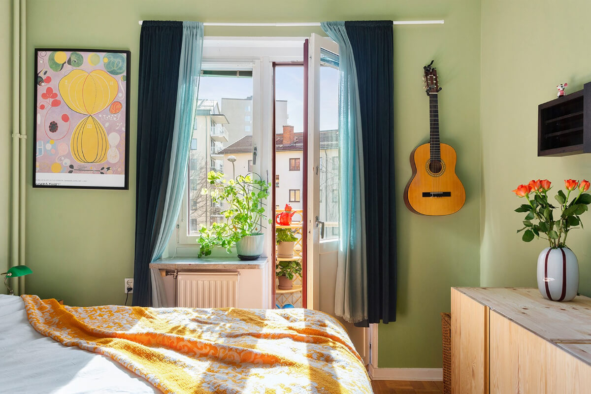 A Colorful 1940s Apartment in Stockholm 12 green bedroom balcony doors