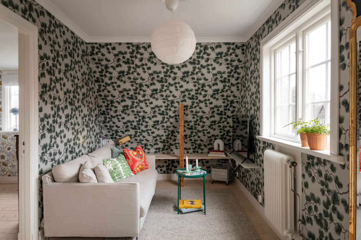 Turn-of-the-Century Charm Meets Modern Comfort in a Swedish House 17 green wallpaper sitting room