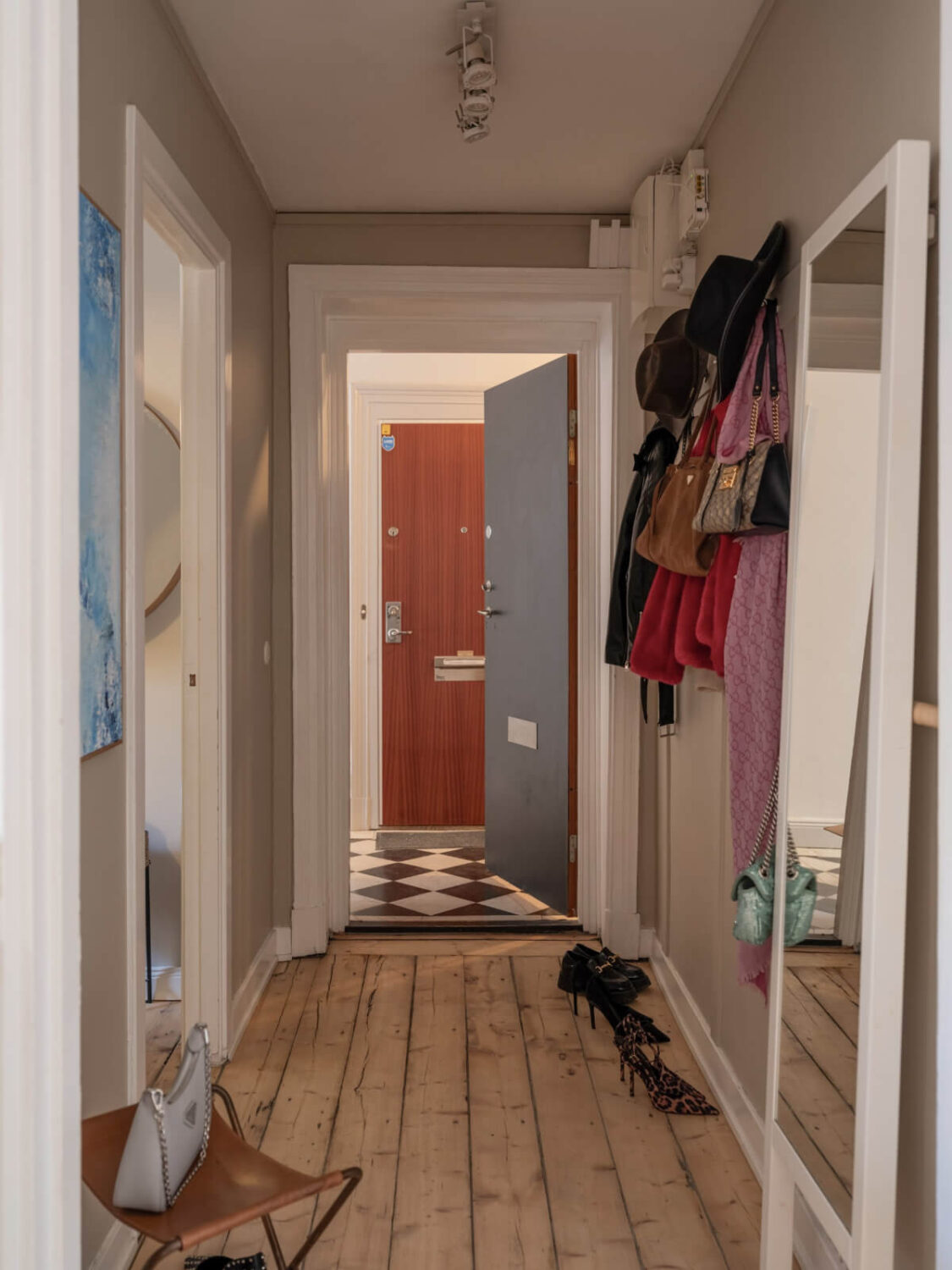 A Small Apartment with Contemporary Furniture in a 19th-Century Building 24 hall large floor mirror rustic wooden floorboards A Small Apartment with Contemporary Furniture in a 19th-Century Building