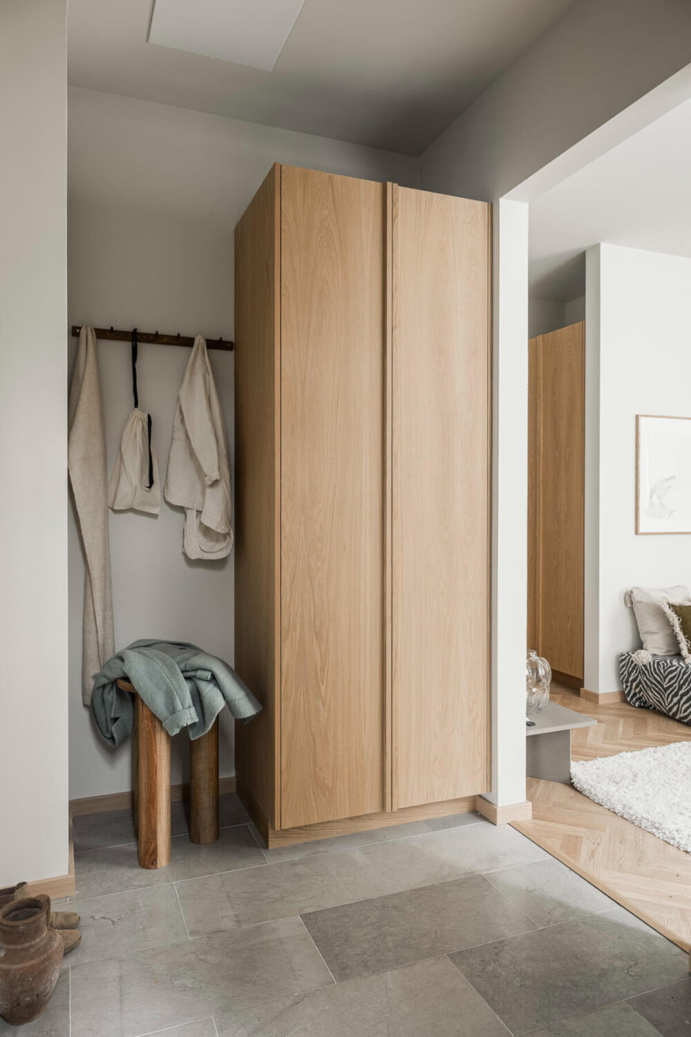A Light-Filled Contemporary Swedish Apartment 26 hall stone floor oak wardrobe