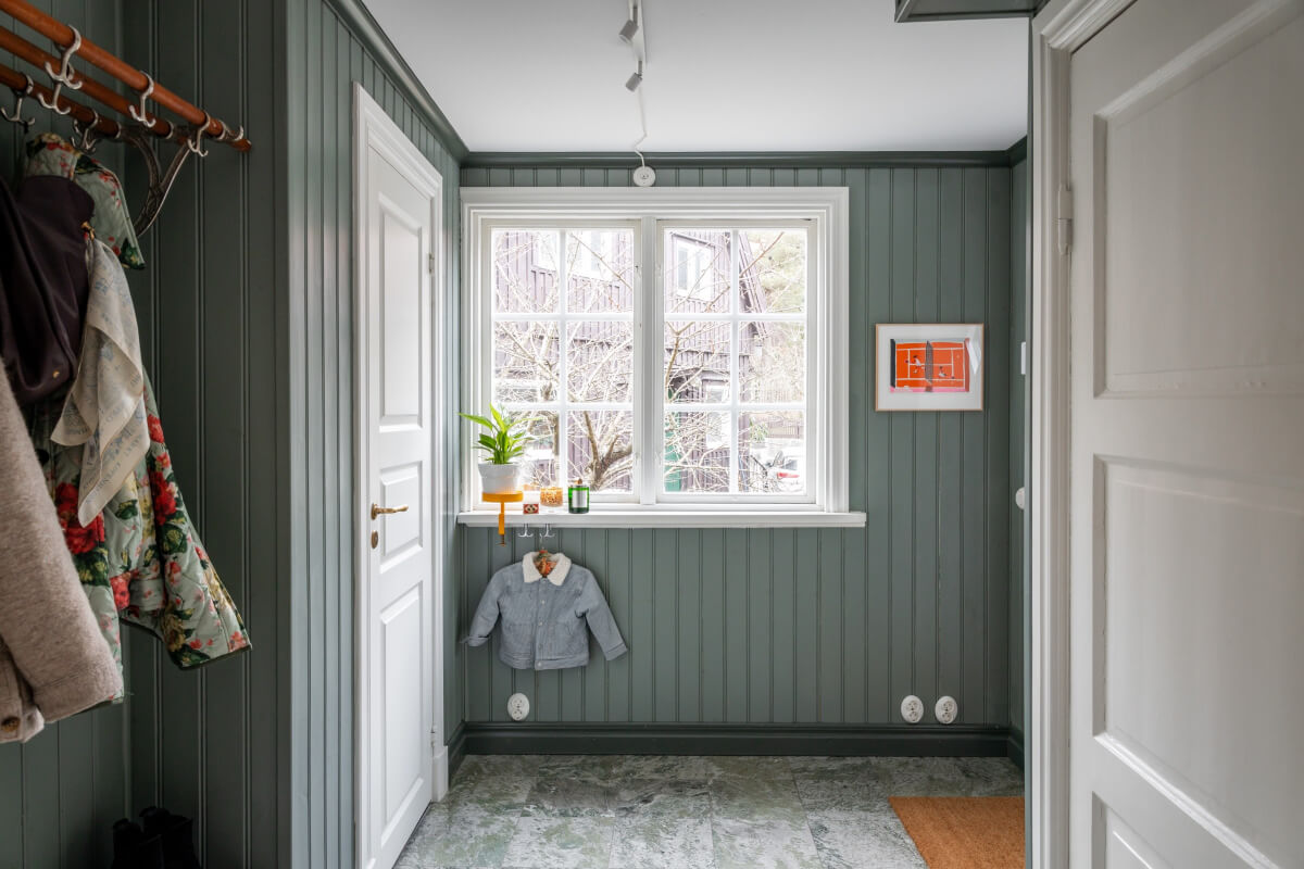 Turn-of-the-Century Charm Meets Modern Comfort in a Swedish House 31 hall wood paneled walls