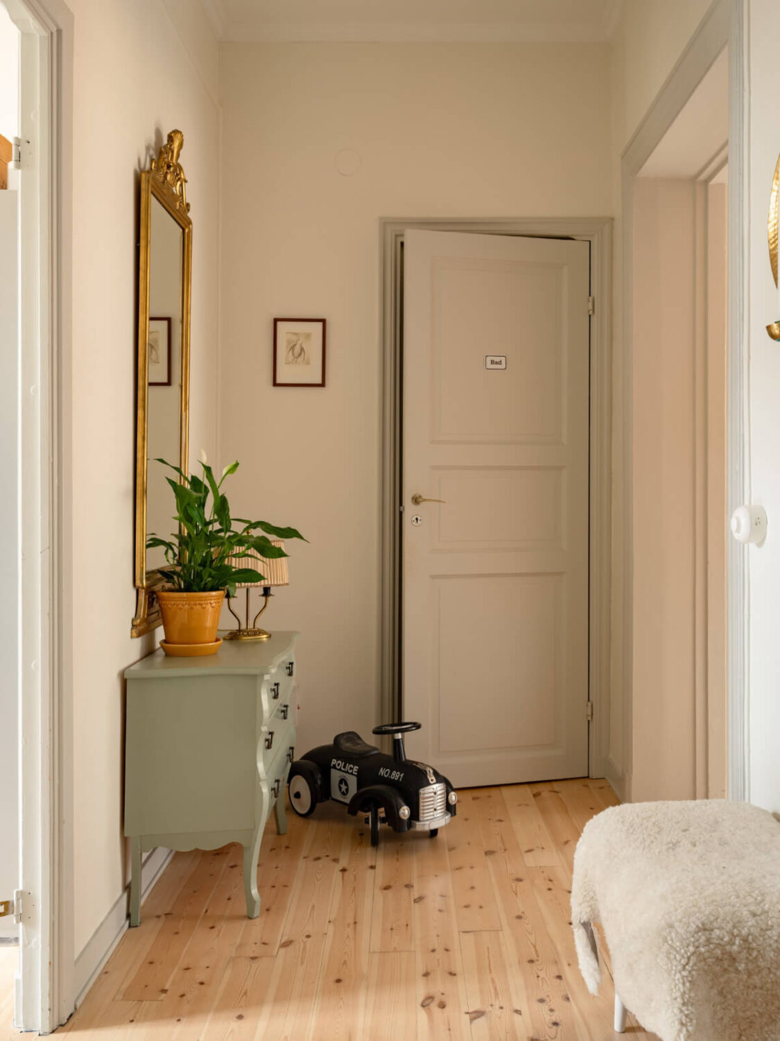 Soft Color Tones in a Renovated Turn-of-the-Century Apartment 29 hallway wooden floor