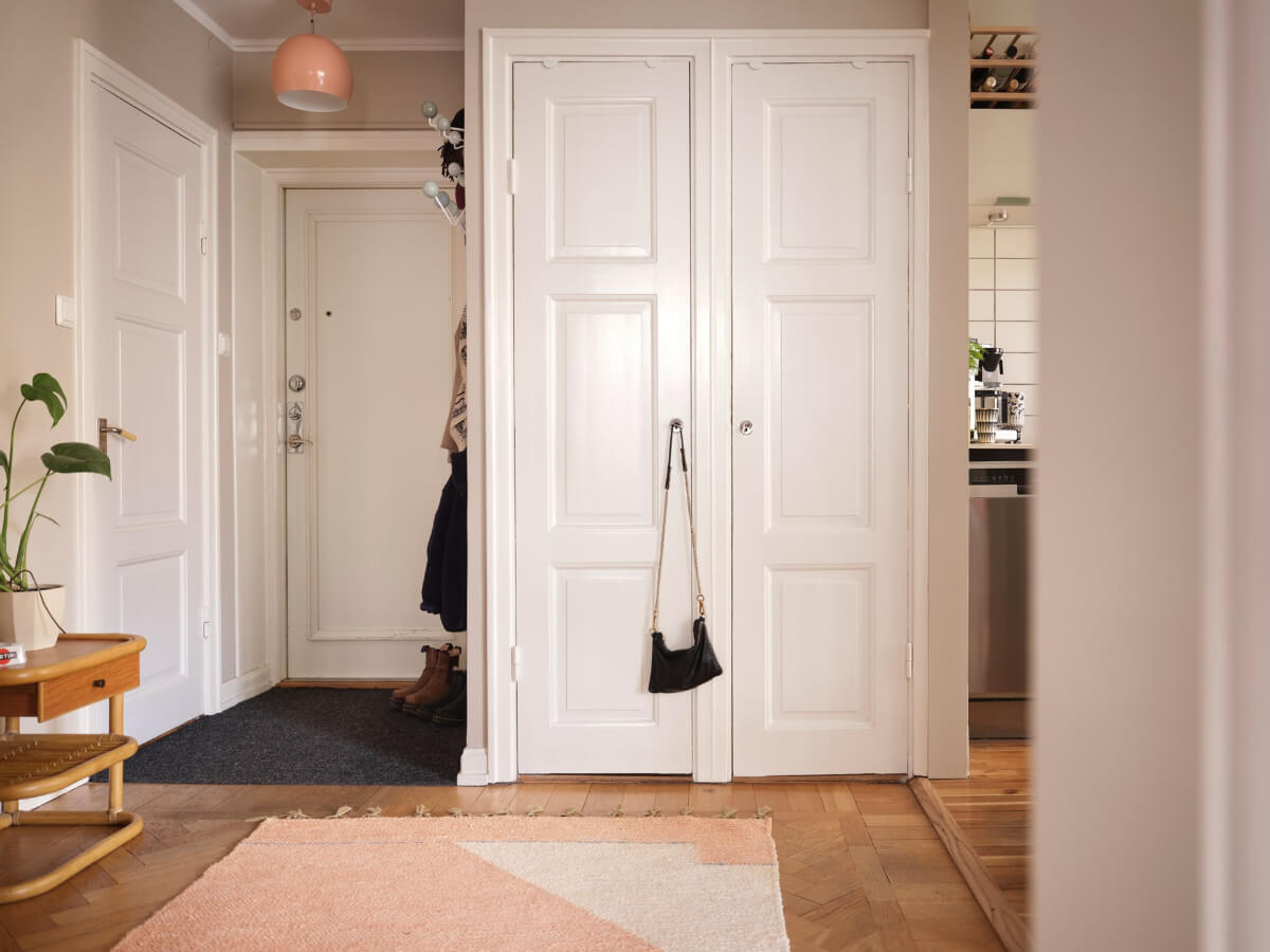 A Corner Apartment with Period Features and Bright Color Pops 23 inner hall with built-in closets