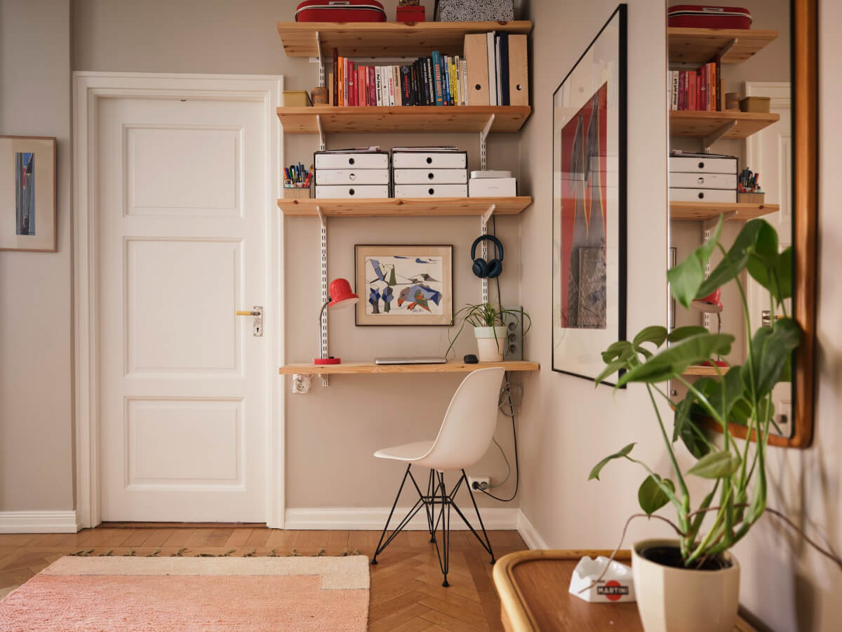 A Corner Apartment with Period Features and Bright Color Pops 21 inner hall with home office with bookshelves